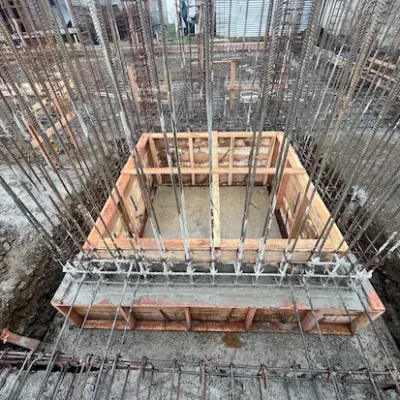 Construction of elevator pit and structure with wood formwork and steel rebar