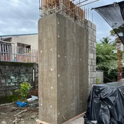 Freshly poured reinforced concrete column at construction site
