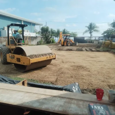 Soil compaction with heavy machinery for building foundation