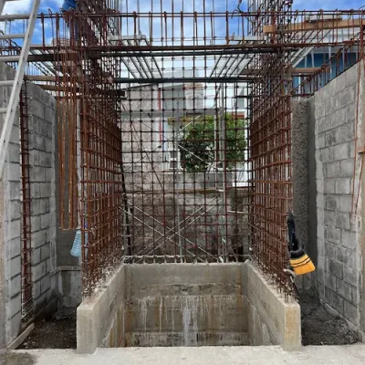 Steel and concrete structure of a staircase under construction with formwork and metal reinforcement