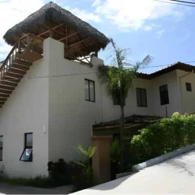 Two-story house with rooftop palm rancho and terrace in Costa Rica
