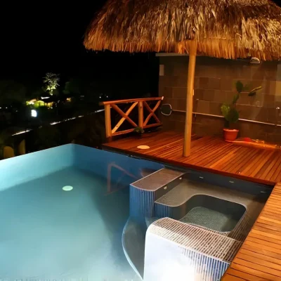 Luxury infinity pool with wooden deck and tropical-style terrace in Costa Rica